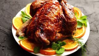videoblocks roasted whole chicken or turkey served in white ceramic