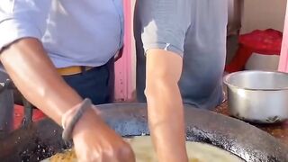 This trader scrapes it and takes it directly using his hands