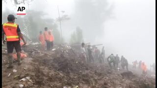 Landslides hit Indonesia's Sulawesi island, killing at least 18 people.