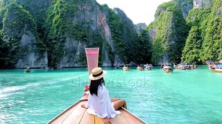A beautiful girl in the middle of picturesque nature, with the harmonious colors of the beach and other picturesque surface features