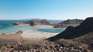 Panoramic landscape to a sunny and paradise beach - adalinetv