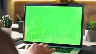 Unrecognizable person using mockup laptop working remotely at home close up