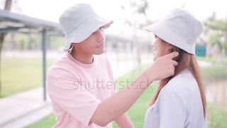 Young couple hugging each other standing outside the station Talk during the day share dreams and plan future ideas together