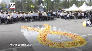 South Koreans and bereaved families of Sewol Ferry sinking commemorate 10th anniversary of disaster.