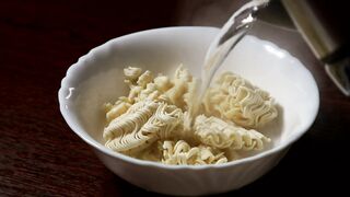 water served in a dish with noodles - adalinetv