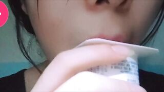 Loli licks yogurt