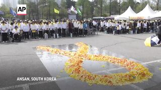 South Koreans and bereaved families of Sewol Ferry sinking commemorate 10th anniversary of disaster.