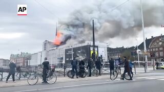 Fire rages through 17th-century old Stock Exchange in Copenhagen.