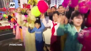 North Korean TV shows Kim Jong Un opening new apartment development project.