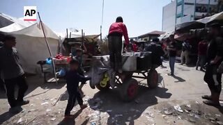Charity workers in Gaza distribute food to children as famine looms.