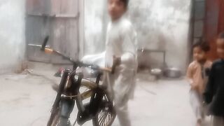 A boy is riding bicycle