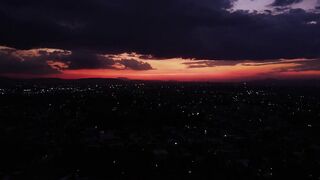 Tour high above a city at dusk - adalinetv