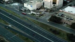 Aerial view of a highway in a big city - adalinetv