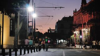 City street with trolleybus at night - adalinetv