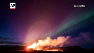 Northern Lights shine over Iceland's erupting volcano.