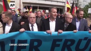 German far-right figure charged for uttering Nazi slogan _ AP explains.