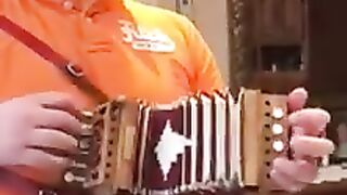 a great concertina player with a small concertia