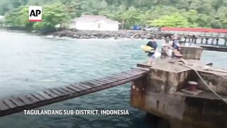 Indonesians leave homes near erupting volcano due to ash, falling rocks and tsunami possibility.