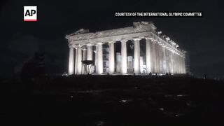 Moment Olympic torch arrives in Athens, Greece, for lighting.