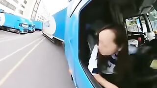 Woman showcasing impressive driving skills reversing a trailer