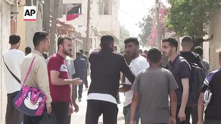 Palestinians evacuate area of Rafah just before Israeli airstrike.
