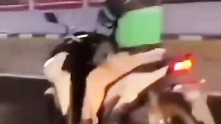 The danger is not to be imitated by a motorbike rider not holding on to the handlebars