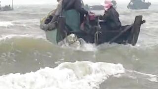 Sea waves and small boat