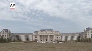 China offers rare admission to international media to its submarine academy.