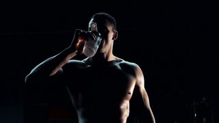 A bodybuilder is drinking water - adalinetv