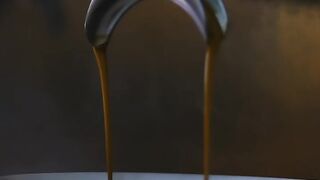 Cup being filled with coffee in a coffee machine - adalinetv