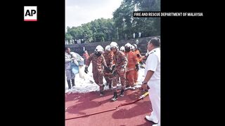 Two Malaysian military helicopters collide and crash in training, killing all on board.