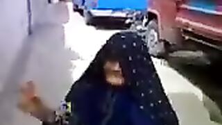An old woman climbing the wall