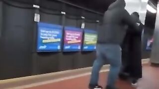 Two men fighting in a train tunnel