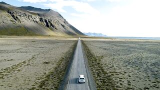 Car driving on an empty road in the countryside -adalinetv