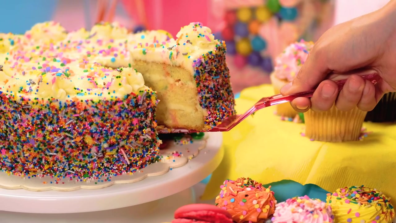 Taking a slice of birthday cake Febspot