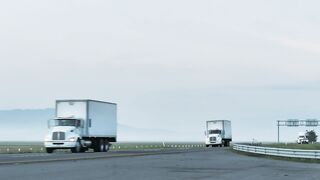 Trailers on a foggy road - adalinetv