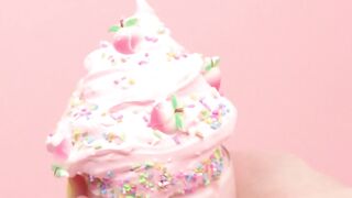 Hands of a woman showing ice cream shaped pink plasticine