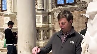 Artist Daniel Arsham assisting visually impaired man enjoy his Star Wars art