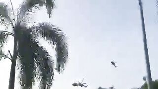 Two helicopters crashing mid air.