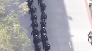 Dozens of LAPD officers begin to break up demonstration at USC