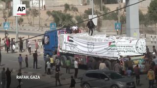 Trucks enter Gaza at the Rafah Crossing bringing much-needed aid supplies.