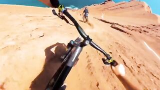 Mountain biking down a seaside dune