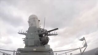 Navy CIWS Gun System Locks Onto Incoming Aircraft.