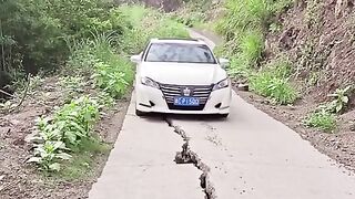 Three guys fix and clean a road.