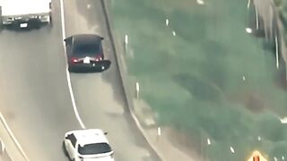 A truck driver assisted police in apprehending the vehicle that was being pursued.