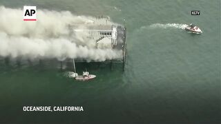 Coast Guard and fire crews battle fire on California pier.