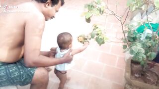 THE BABY LIKES THE FLOWER