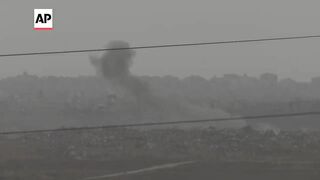 More aid parcels dropped over Gaza as smoke from explosions rises into the sky.