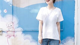 A casual smile in front of a mural, effortlessly blending with everyday life ????????