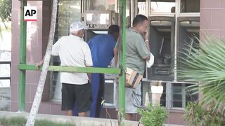 Long lines in front of banks and ATMs as Cubans face another hurdle to their difficult daily routine.